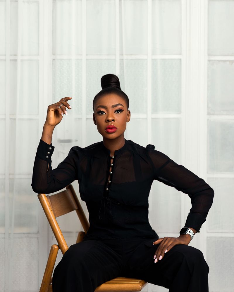 female portrait wearing black jumpsuit