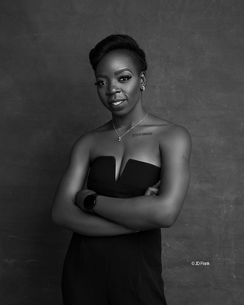 black and white female African portrait with tattoo