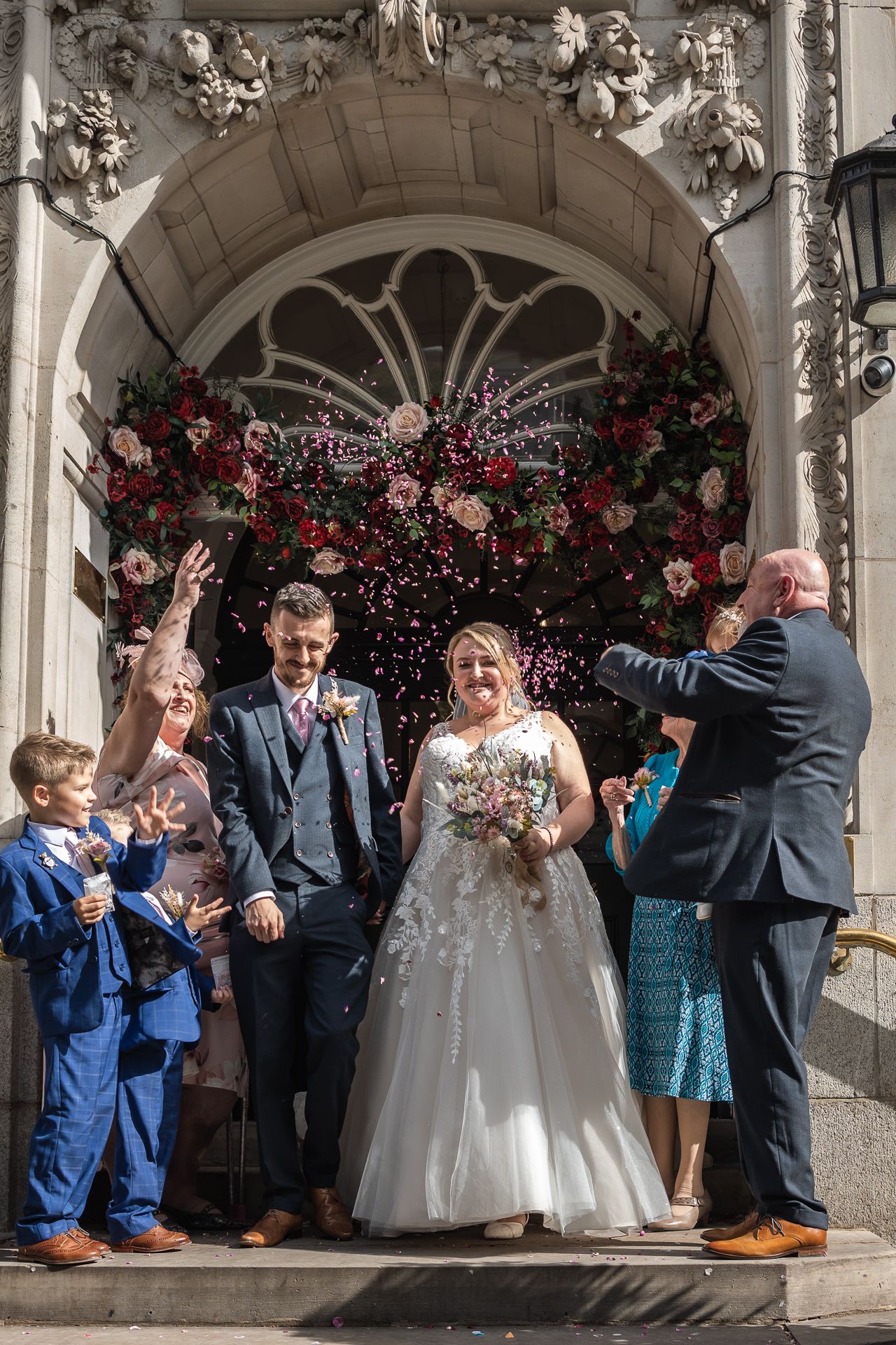 Confetti shot of newly wed couple outside Chelsea old town hall