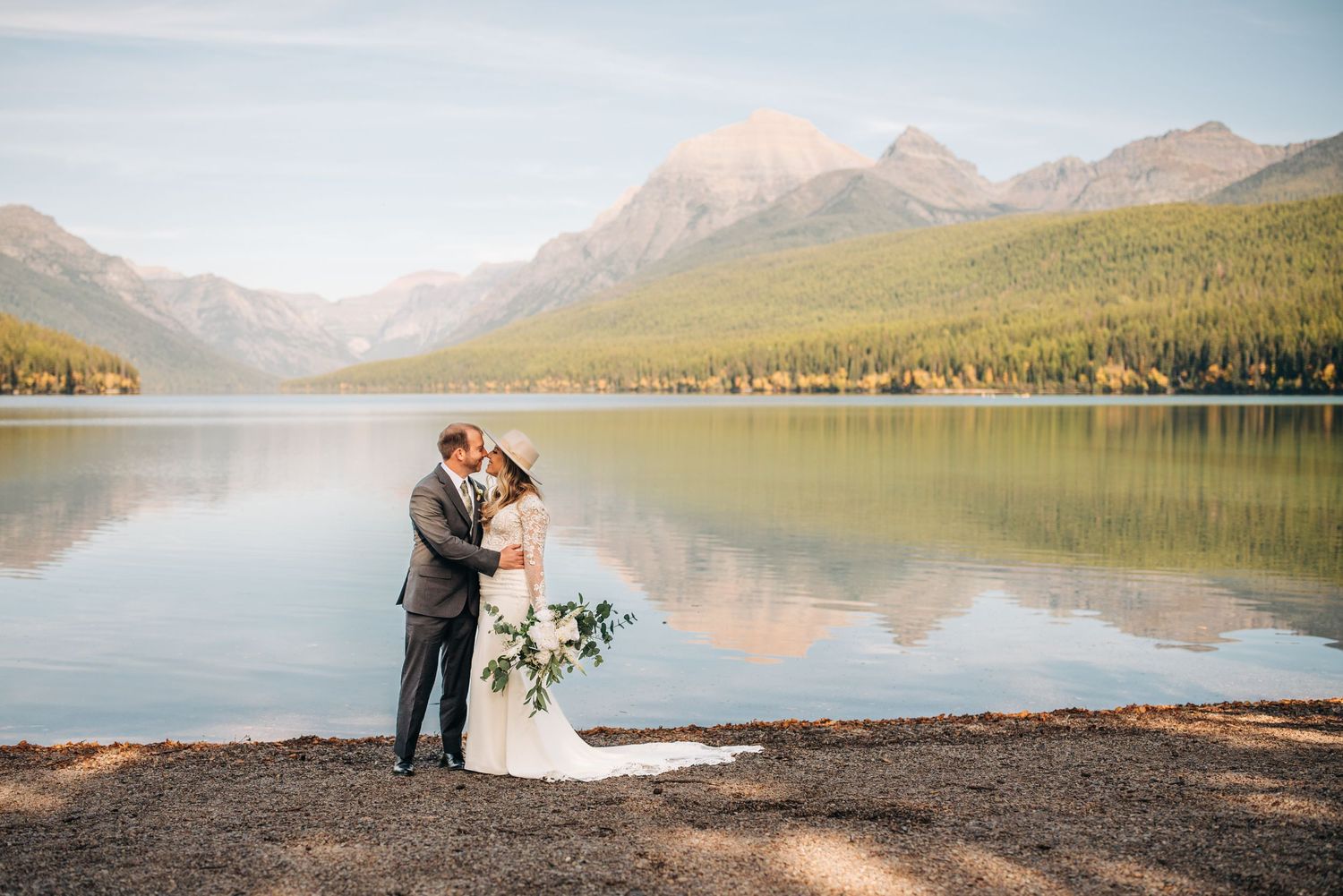 couple getting married at bowman Lake in glacier national park