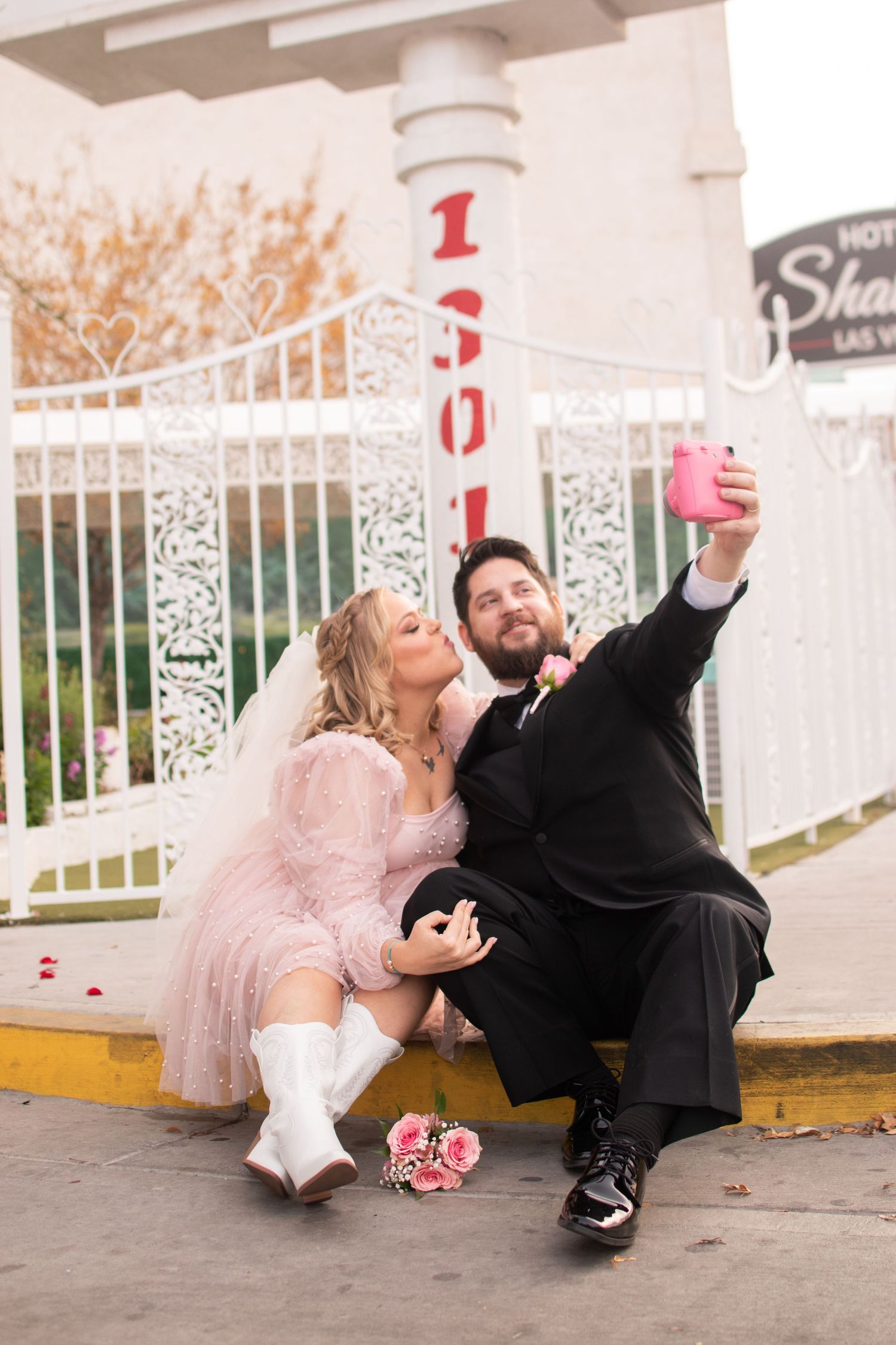 Wedding selfies are a must in front of Little White Chapel with Vintage Film