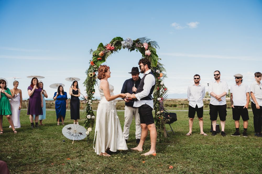 black and white, rings exchange, giving wedding rings, photographers Nelson, Marahau weddings, Abel Tasman elopement