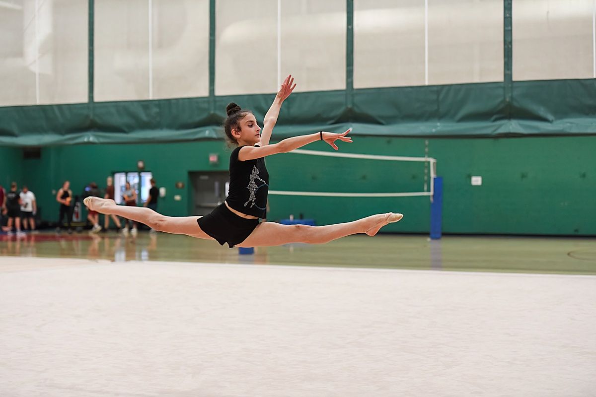 Rhythmic gymnast split leap