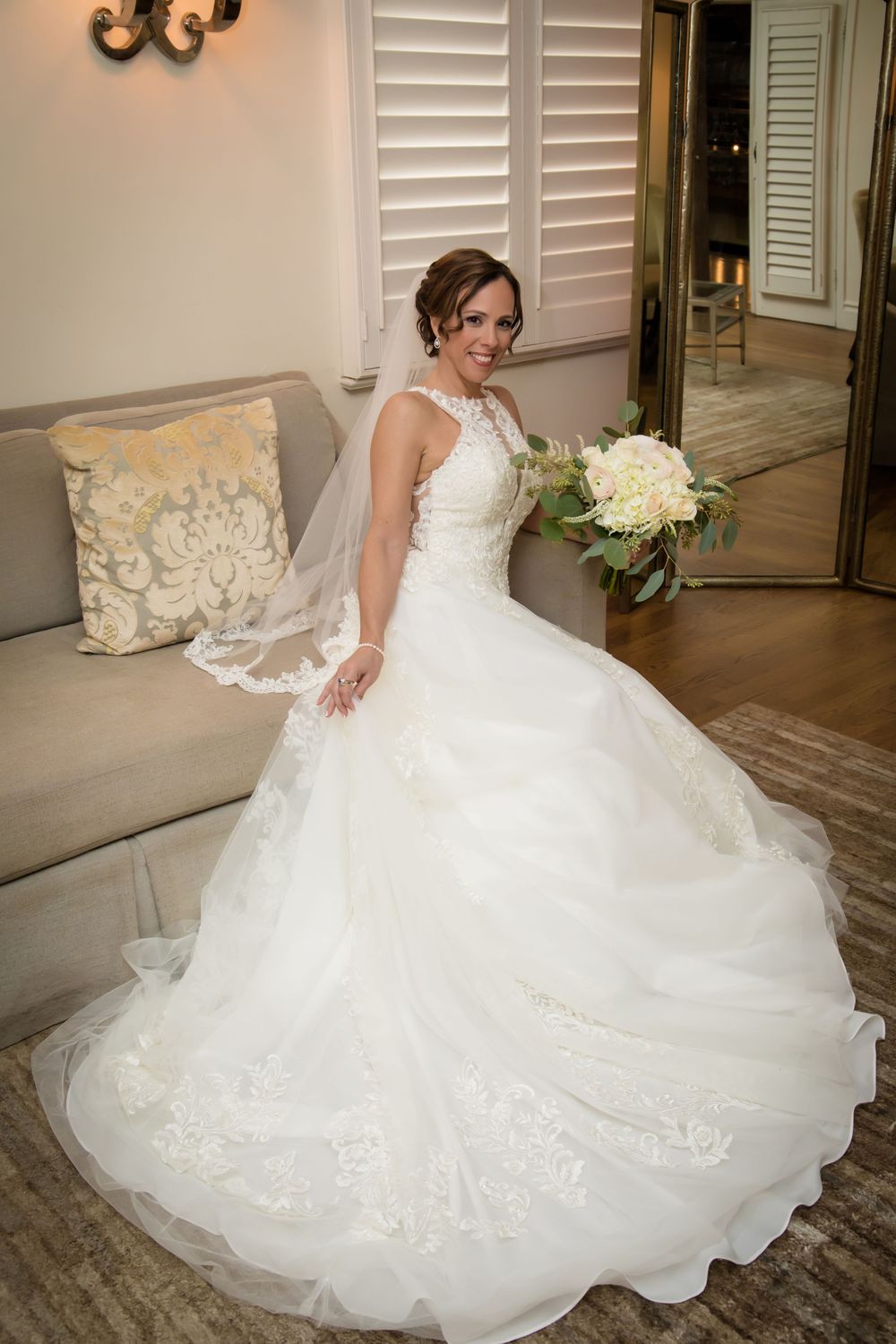 Wedding dress with intricate lace details and full skirt photographed from different angles.