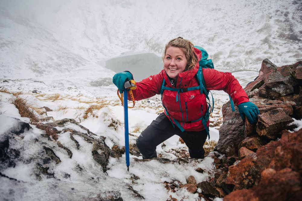 Mountaineer Mollie Hughes winter hiking a munro in the Highlands of Scotland with The Adventure Photographers