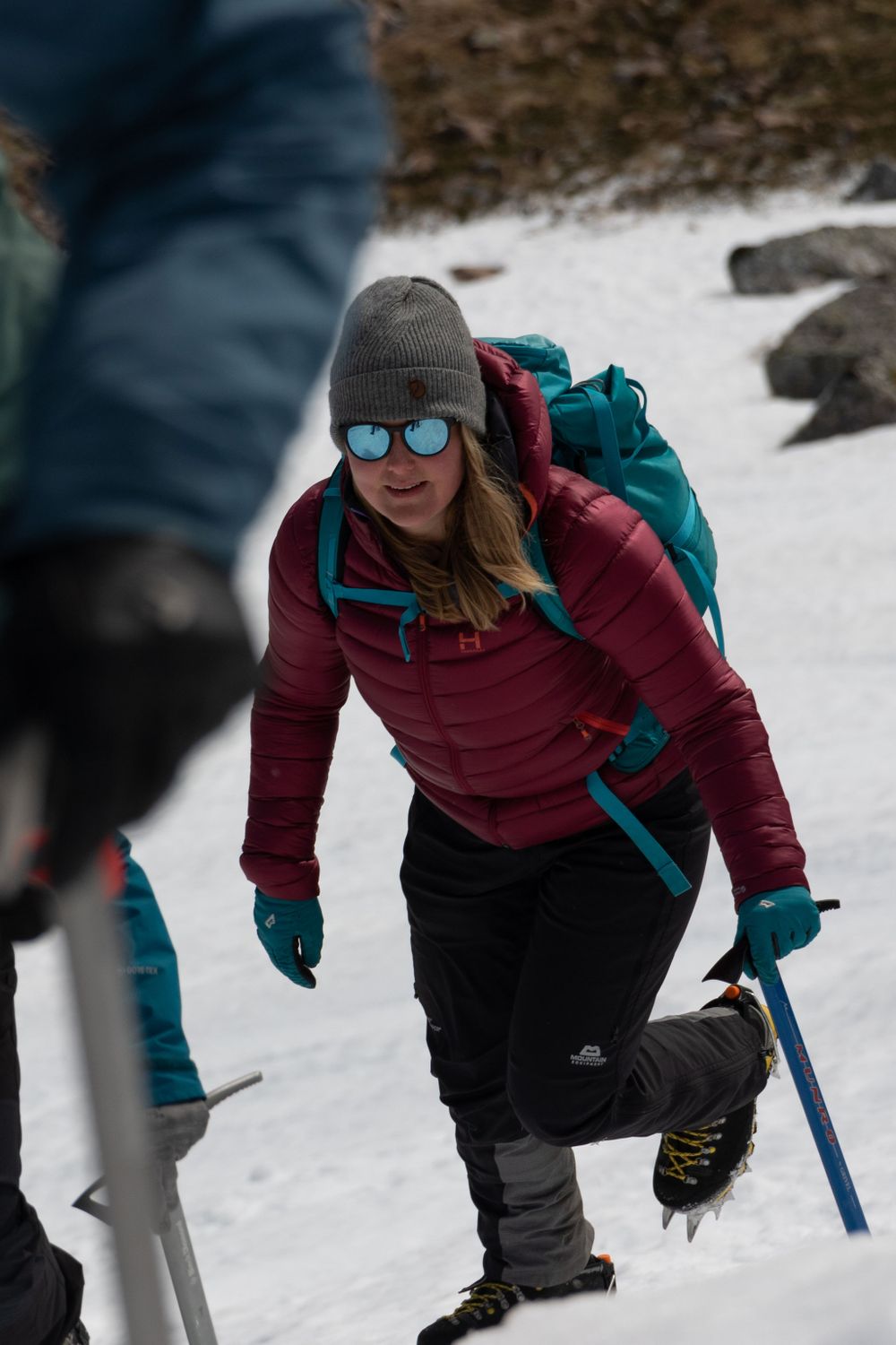 Mollie Hughes mountaineer hikes up snowy slope