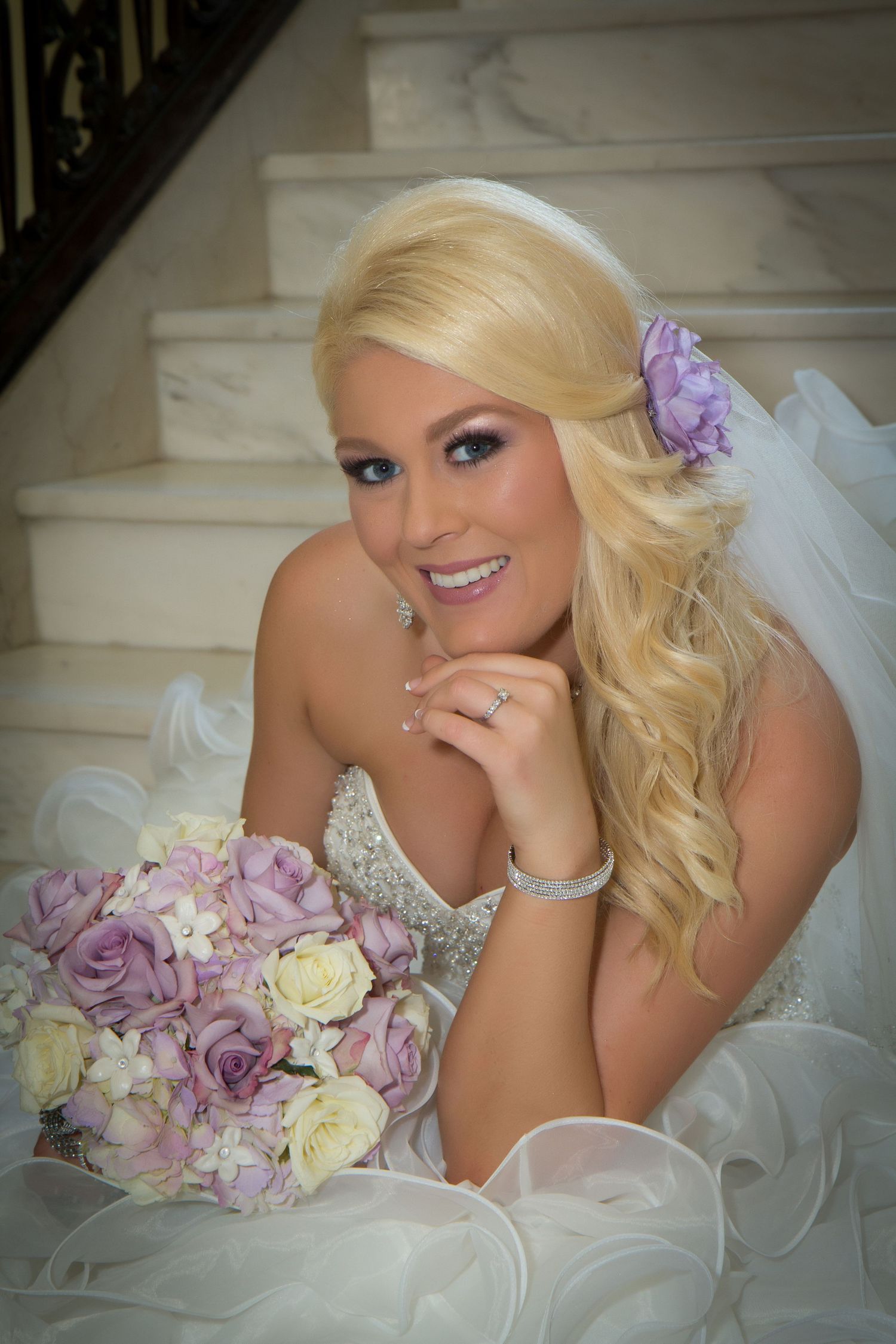 Bridal portrait series featuring a white wedding dress and purple floral bouquet against a light backdrop.