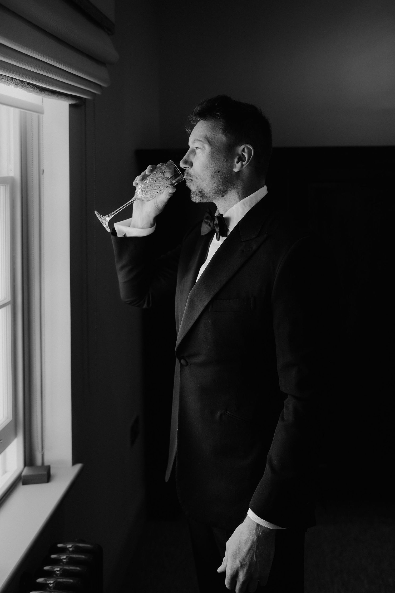 groom-drinking-champagne-stockton-house-wedding-shropshire