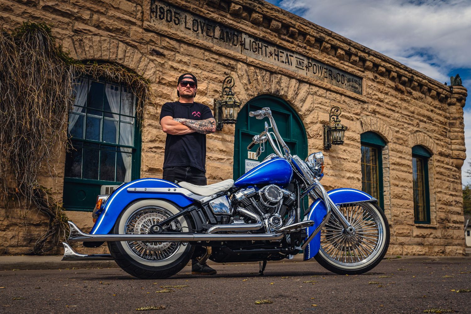 Men's small business branding photo.  Motorcycle build, urban setting.