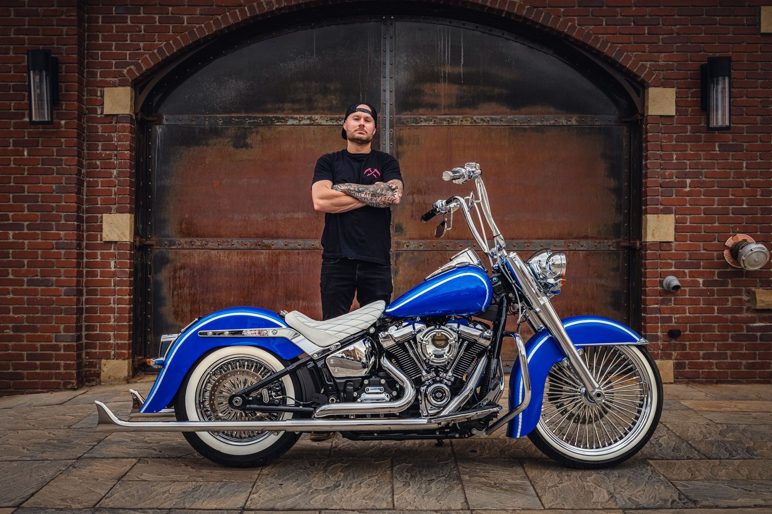 Men's small business branding photo.  Motorcycle build, urban setting.
