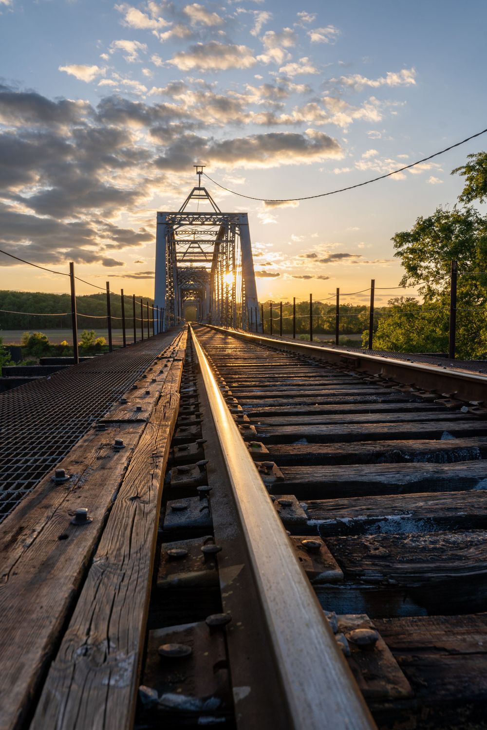 sun setting behind the rail bridge in Clarksville TN