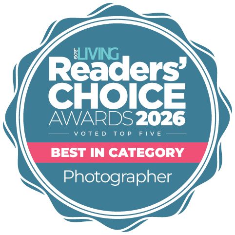A circular blue and pink badge for Living Readers' Choice Awards 2025 recognizing Best in Category Photographer.