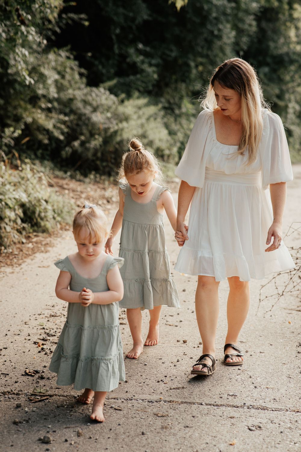 A gentle family walk along a wooded path on a sunny afternoon.