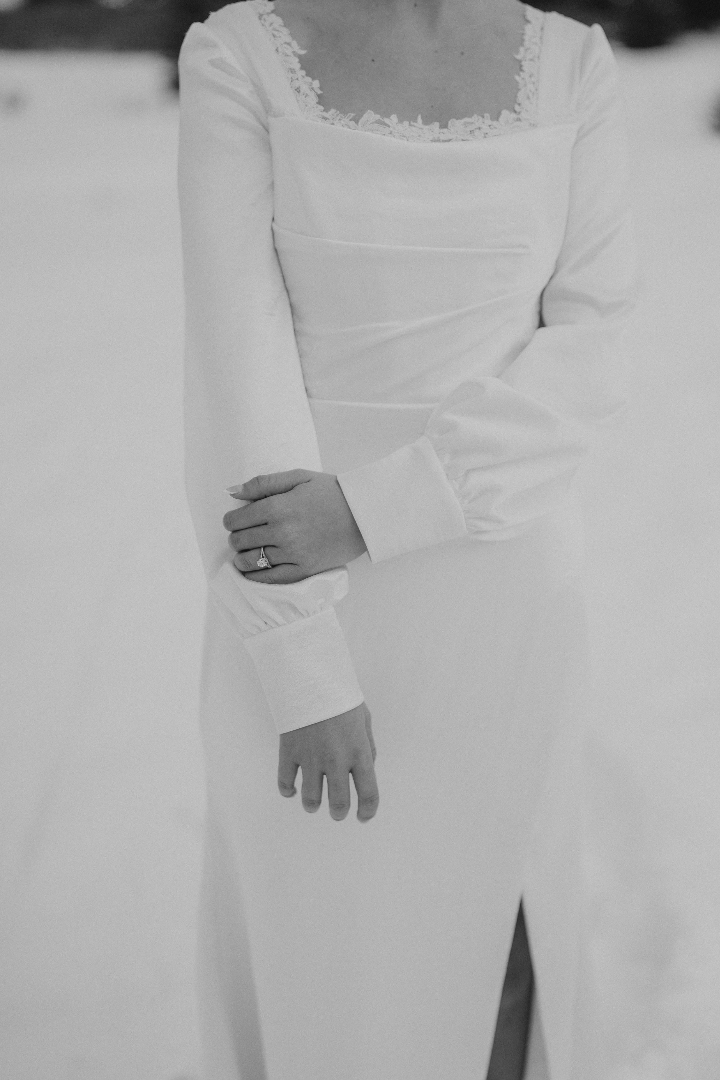 Close-up details of a white wedding dress with lace trim and delicate fabric shown in multiple cropped angles.