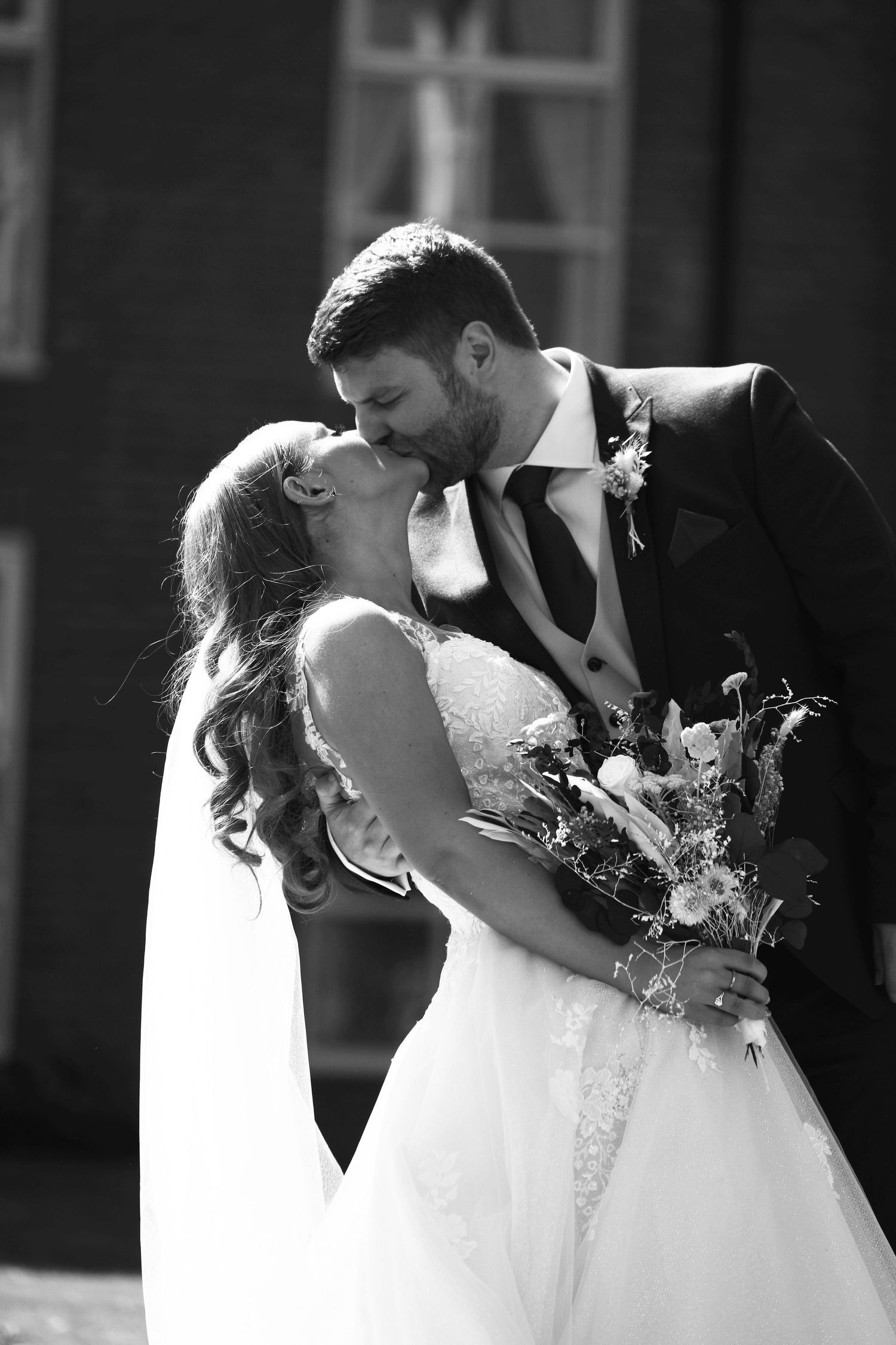Black and white wedding portraits showing intimate romantic moments.
