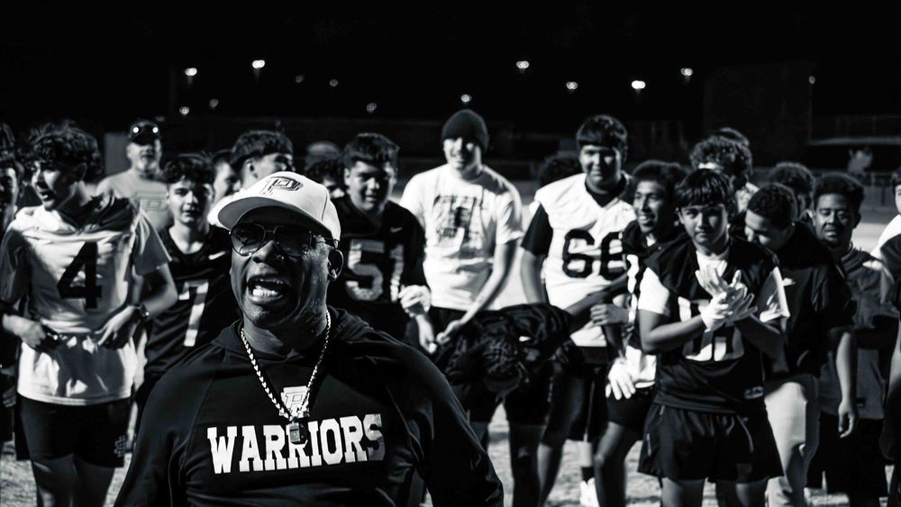 Football coach leading team chant