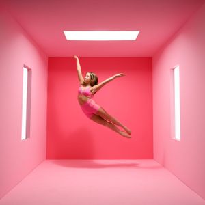 Dynamic dance sequence showing leaps and movements in pink-walled studio space.