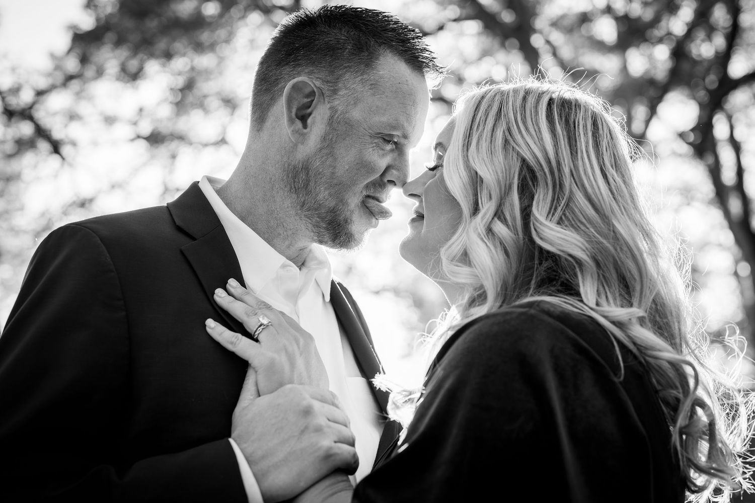 A romantic black and white wedding photo collage showing intimate moments between a couple on their special day.