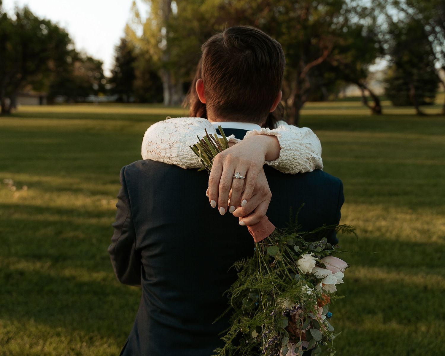 Wedding couple embracing in Logan, UT during a sunset hour.