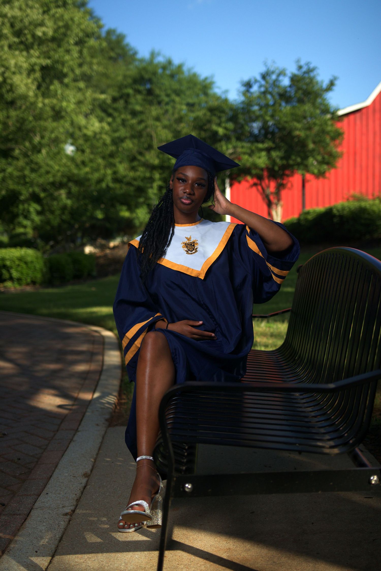Graduation portrait of a smiling student in a cap and gown at McDonough High School