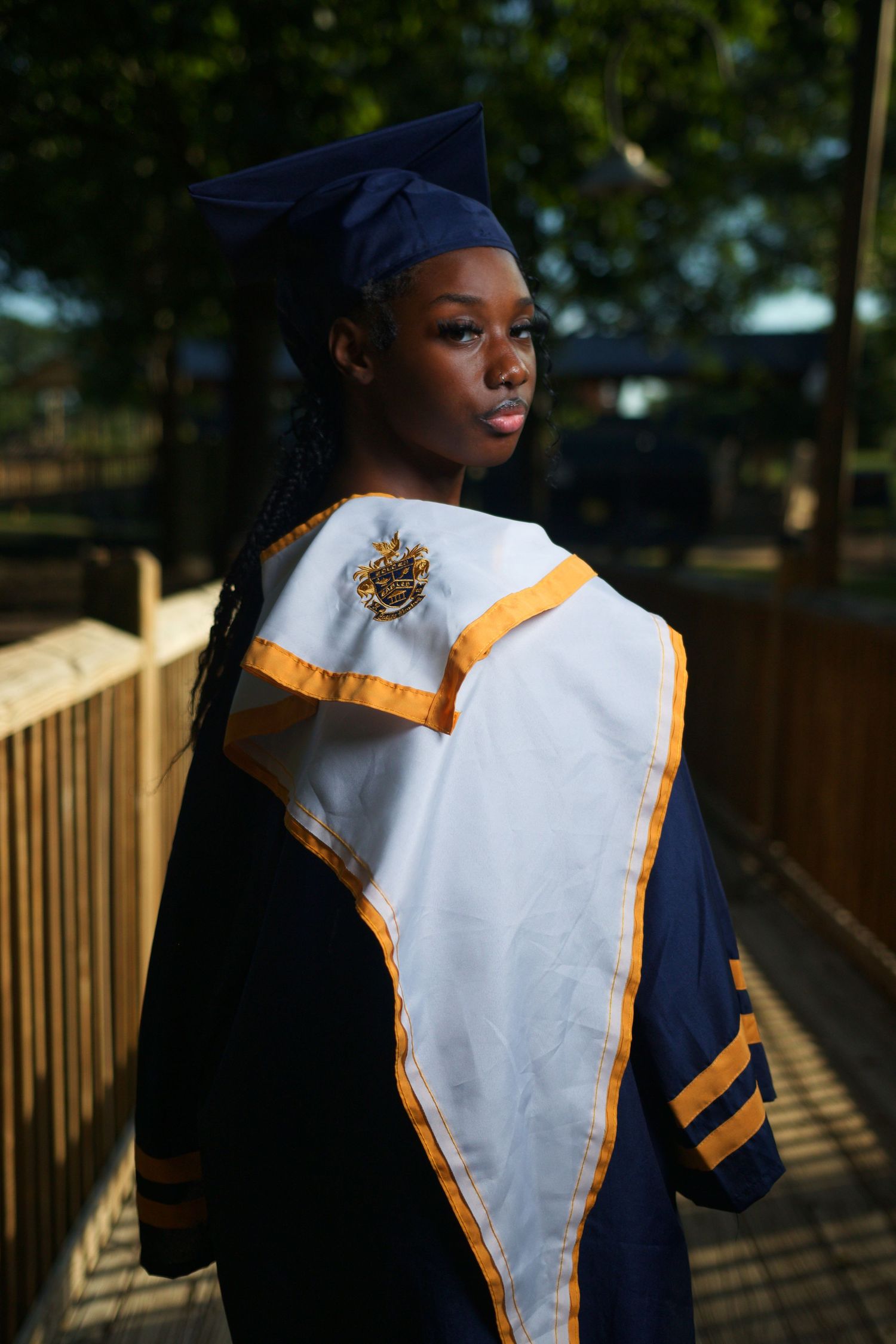 Graduation portrait session at McDonough High School in McDonough, Georgia with cap and gown