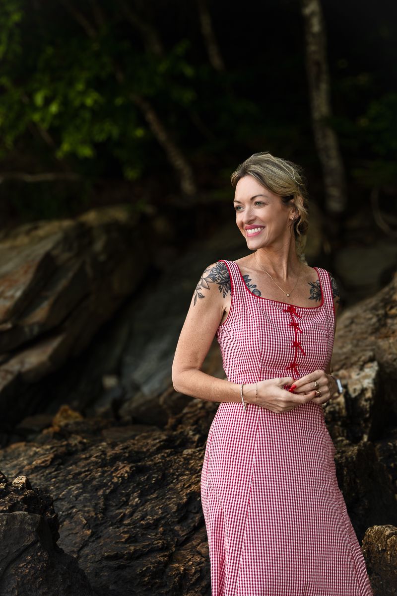 Photo series showing someone in a red gingham dress against a wooded background.