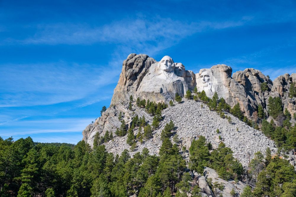 Side view of Mount Rushmore showing the massive scale of the carved presidential faces in the Black Hills.