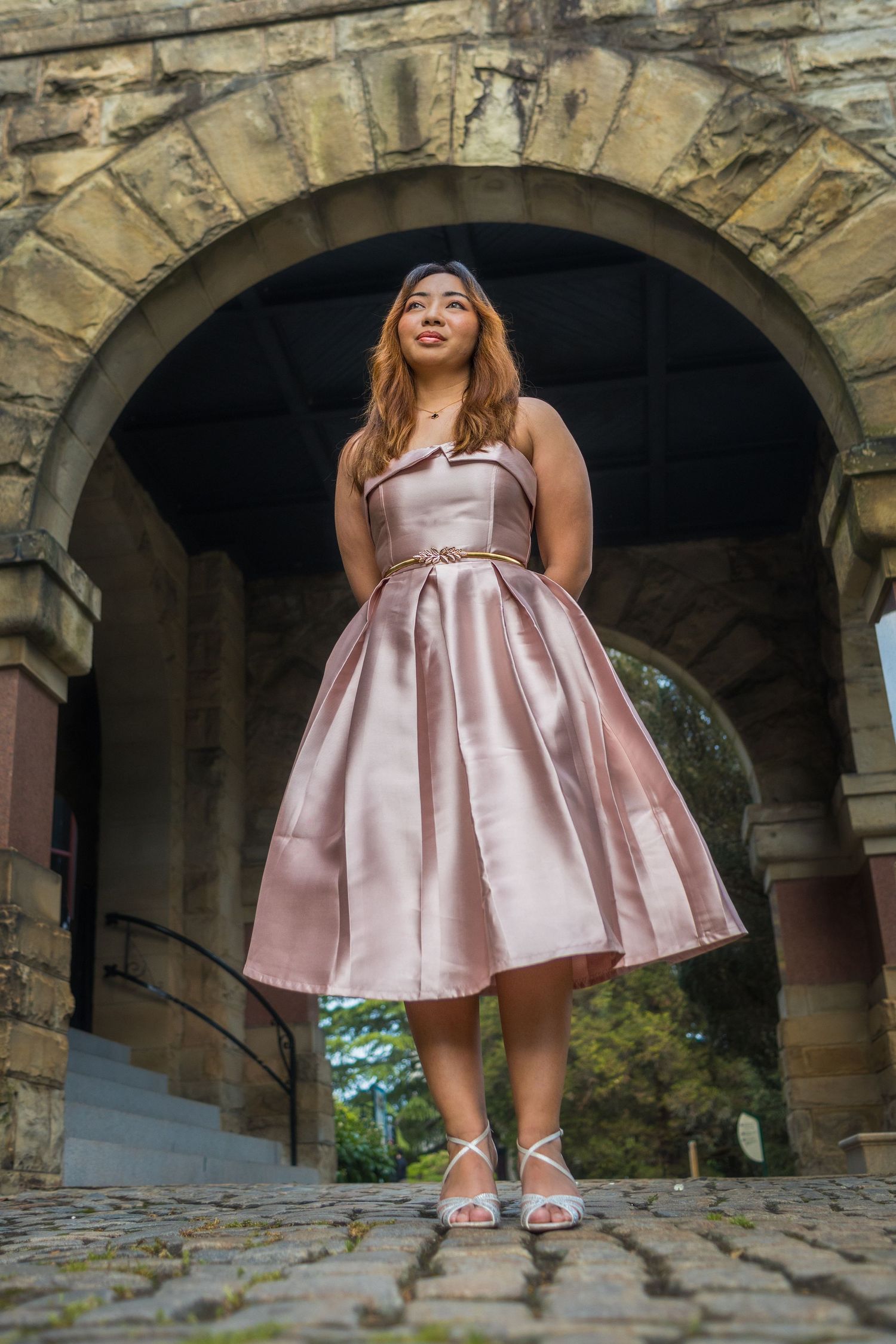 Young woman poses in pink dress at Maymont in Richmond VA. Portrait taken by Chris Suits Photography