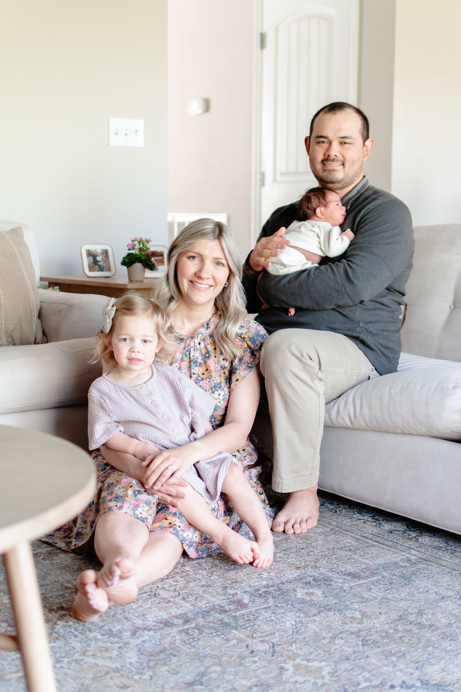 A new family of four relaxes in their Winston-Salem living room.