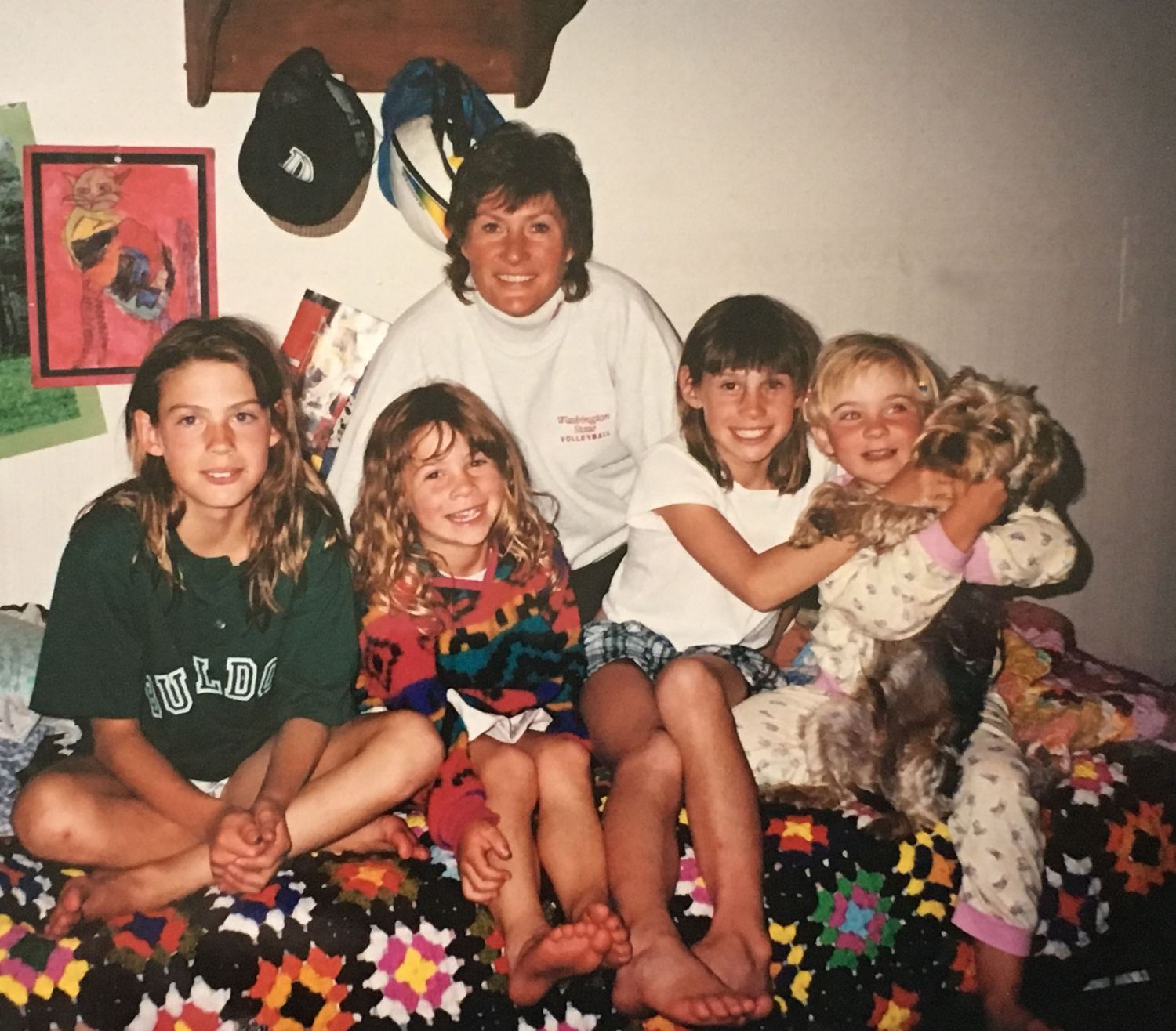 90s photo of family with a dog.