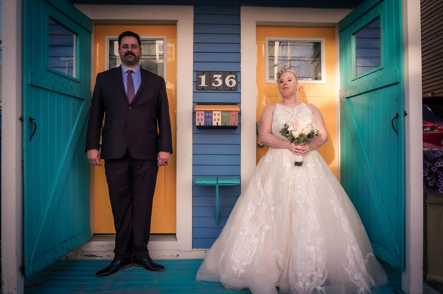 Wedding photo idea at the colorful Jellybean Houses in downtown St. John's, capturing the vibrant charm of the area