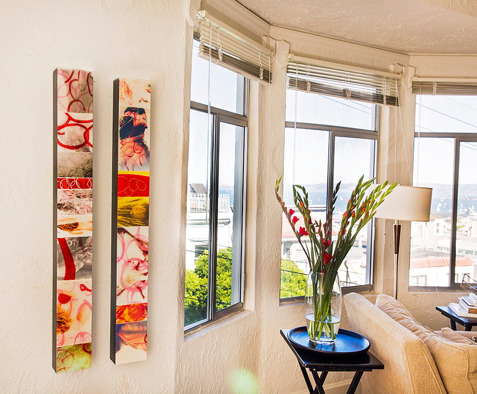 Modern room interior with decorative wall panels and large windows overlooking city view.
