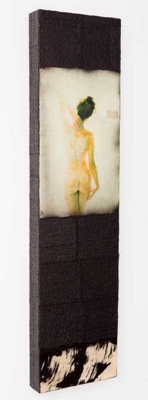 Tall vertical canvas artwork with dark textured frame showing ethereal figure in yellow tones.