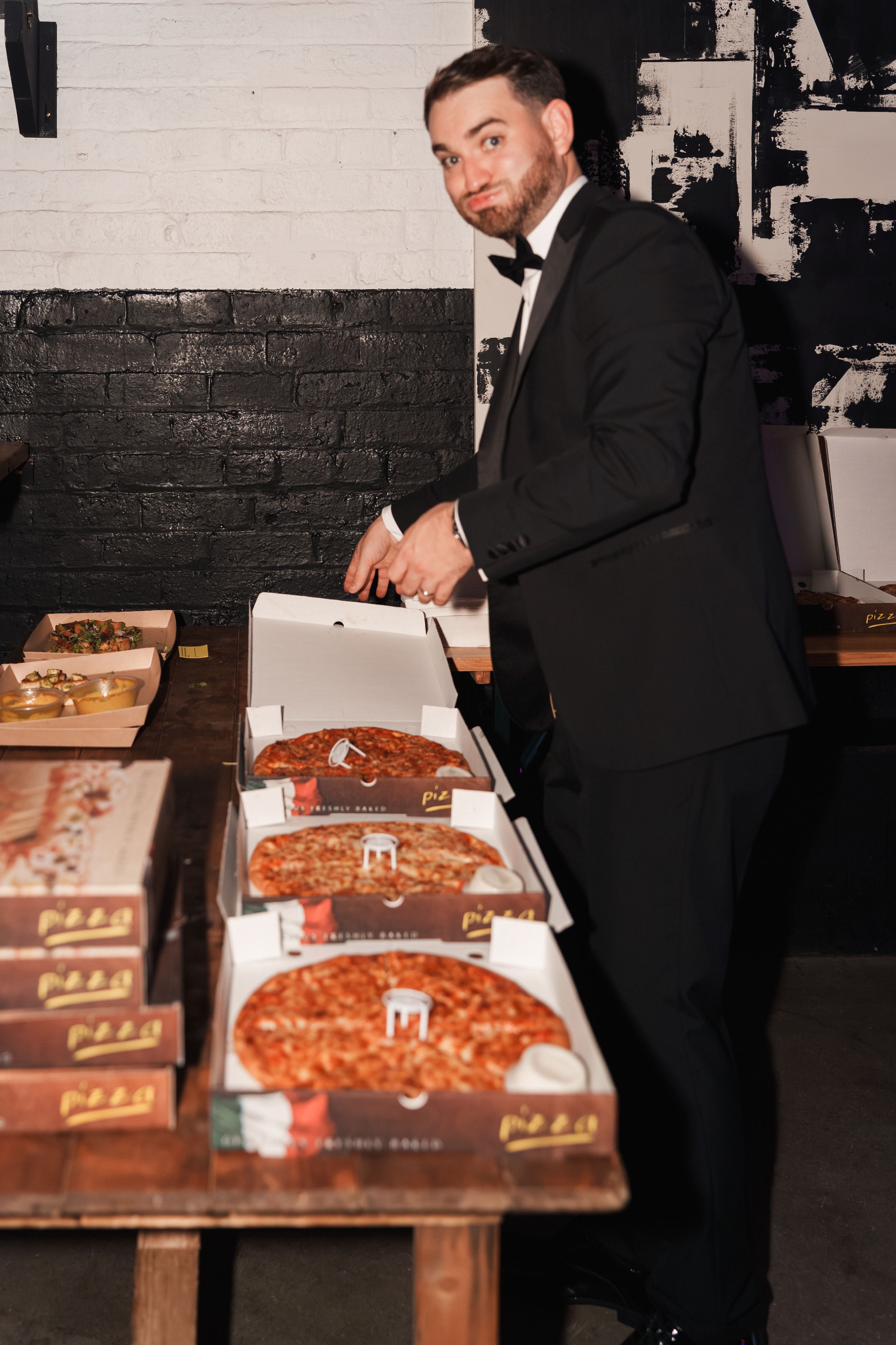 Collection of sequential images showing person in suit signing paper documents on a wooden surface in a dark room.