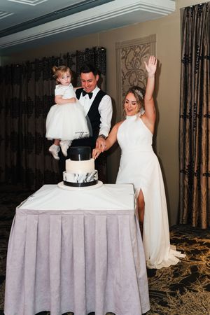 A sequence of wedding cake cutting photos showing a couple in formal attire cutting their tiered white cake at a reception.