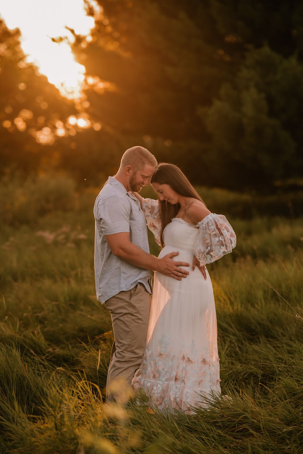 Intimate maternity portraits captured in warm evening light.