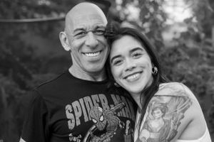 Black and white portrait of Dad and Daughter smiling together.