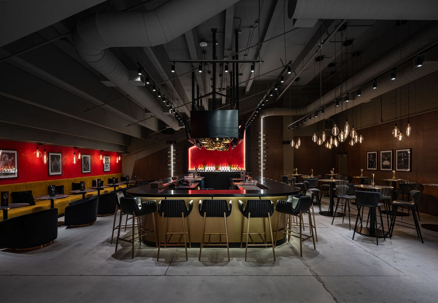 Luxury hospitality photography of Brookstreet Lounge, showcasing moody ambient lighting, curved bar design, and high-end finishings