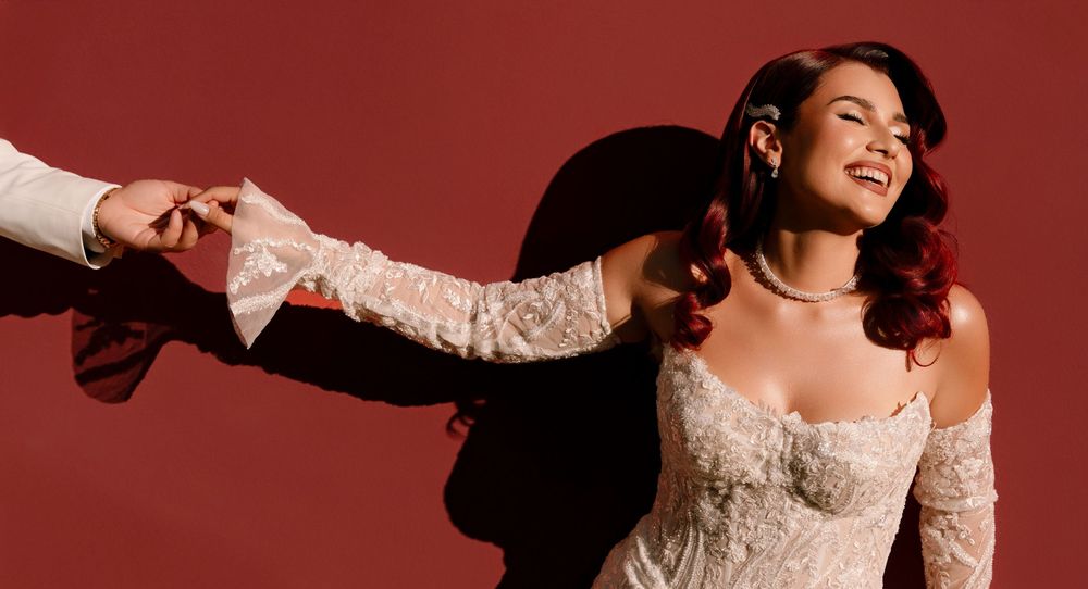 A series of four photos showing a woman in a white lace dress posing expressively against a deep red background.