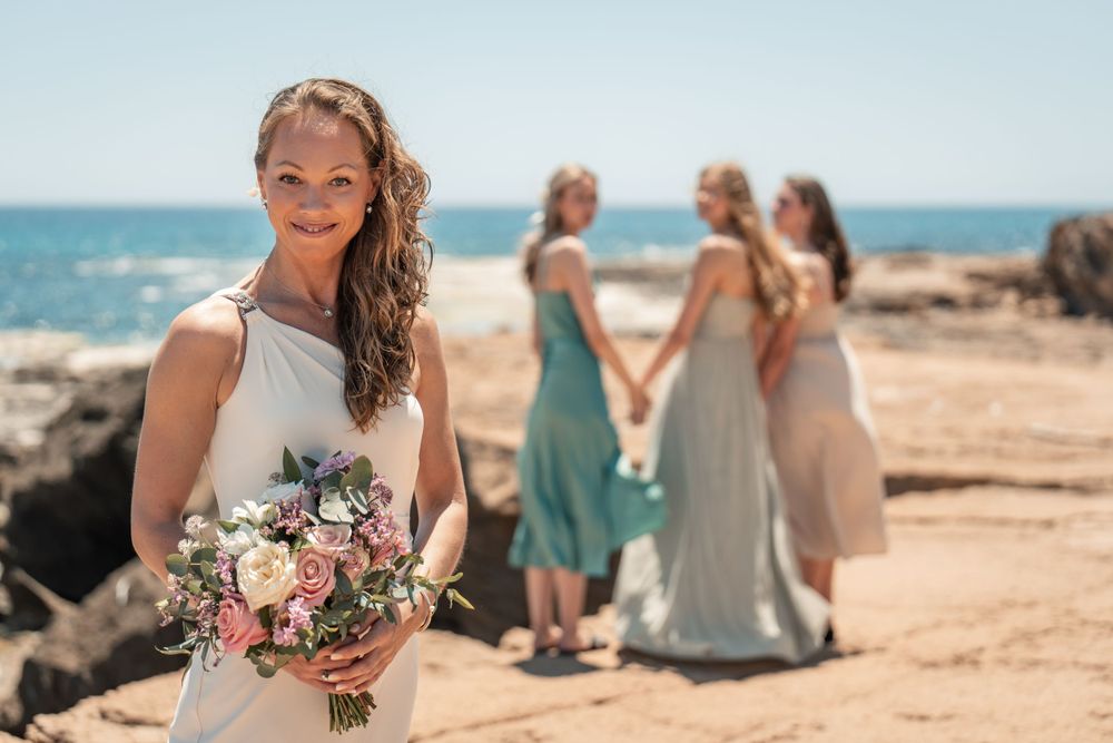 Mom bride with daughters on wedding day