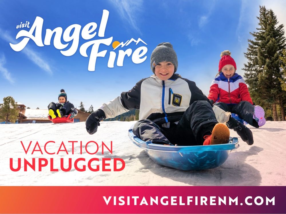 Children sledding down a snowy hill at Angel Fire, NM, promoting a winter vacation getaway with the tagline Vacation Unplugged.