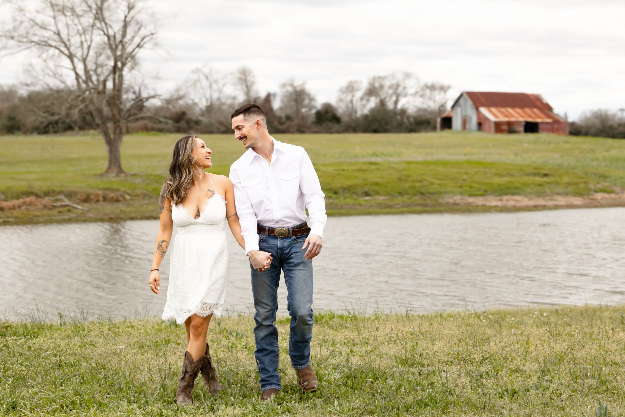 Cute engaged couple looking at each other and walking.