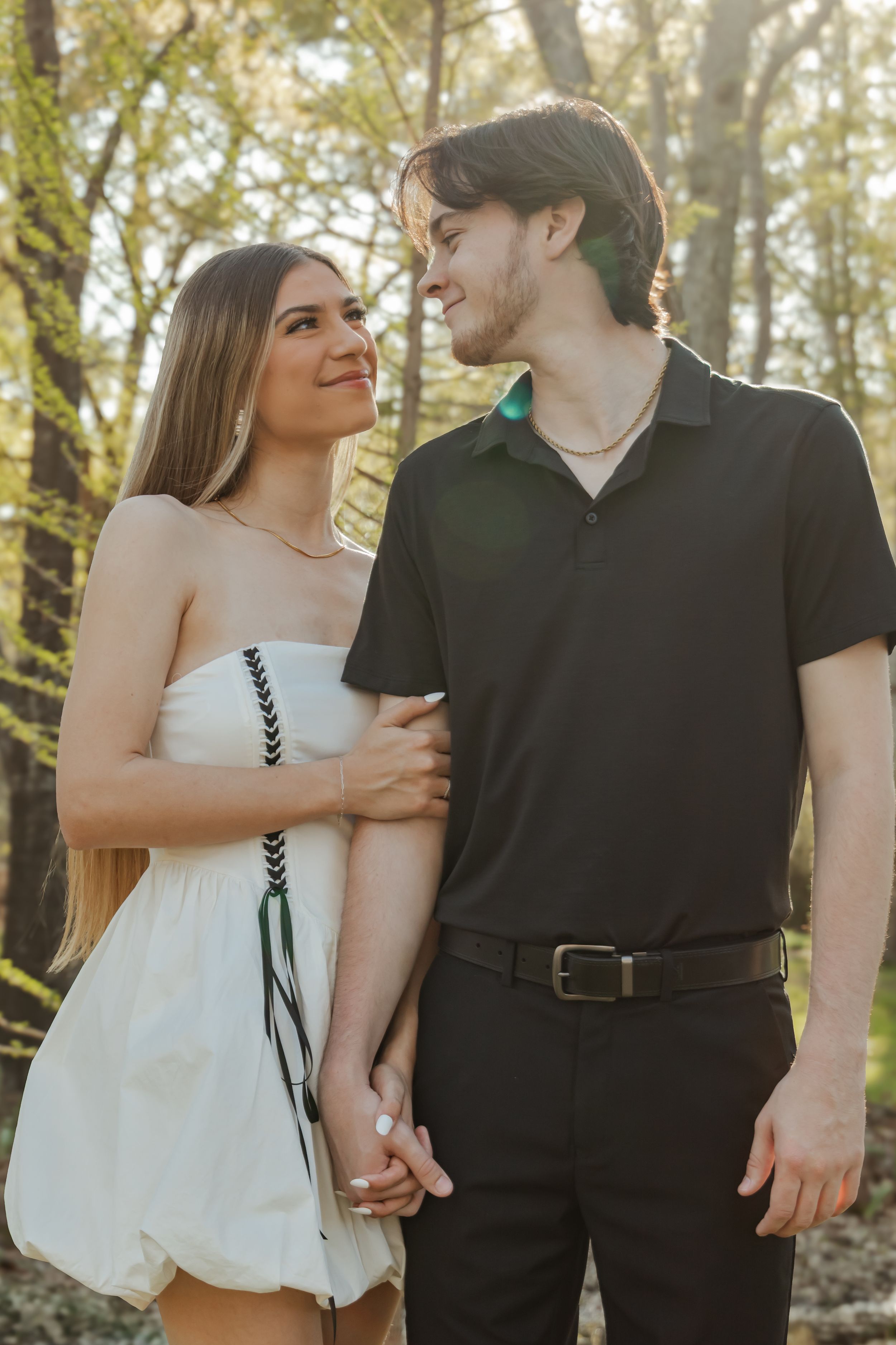 Engaged couple looking into each other's eyes.