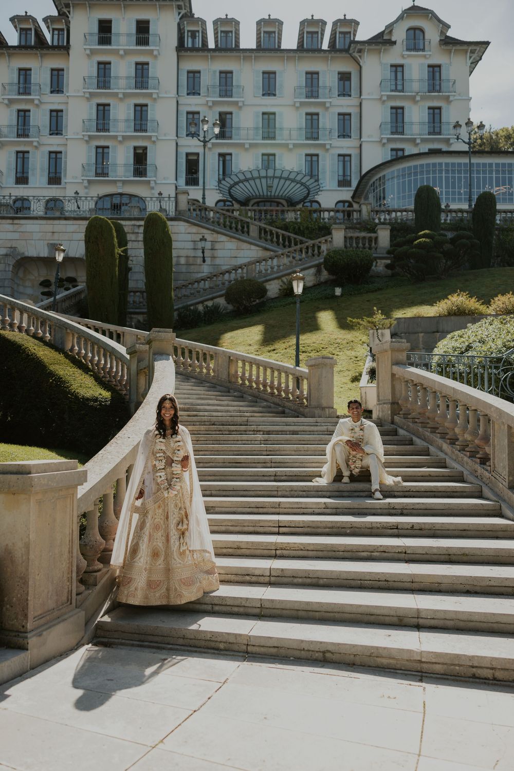 A grand white mansion with elegant stone staircases and landscaped grounds captured in multiple sequential views.
