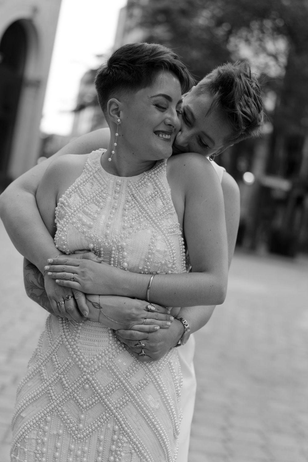 Black and white photo series showing close-up details of an elegant beaded wedding dress.