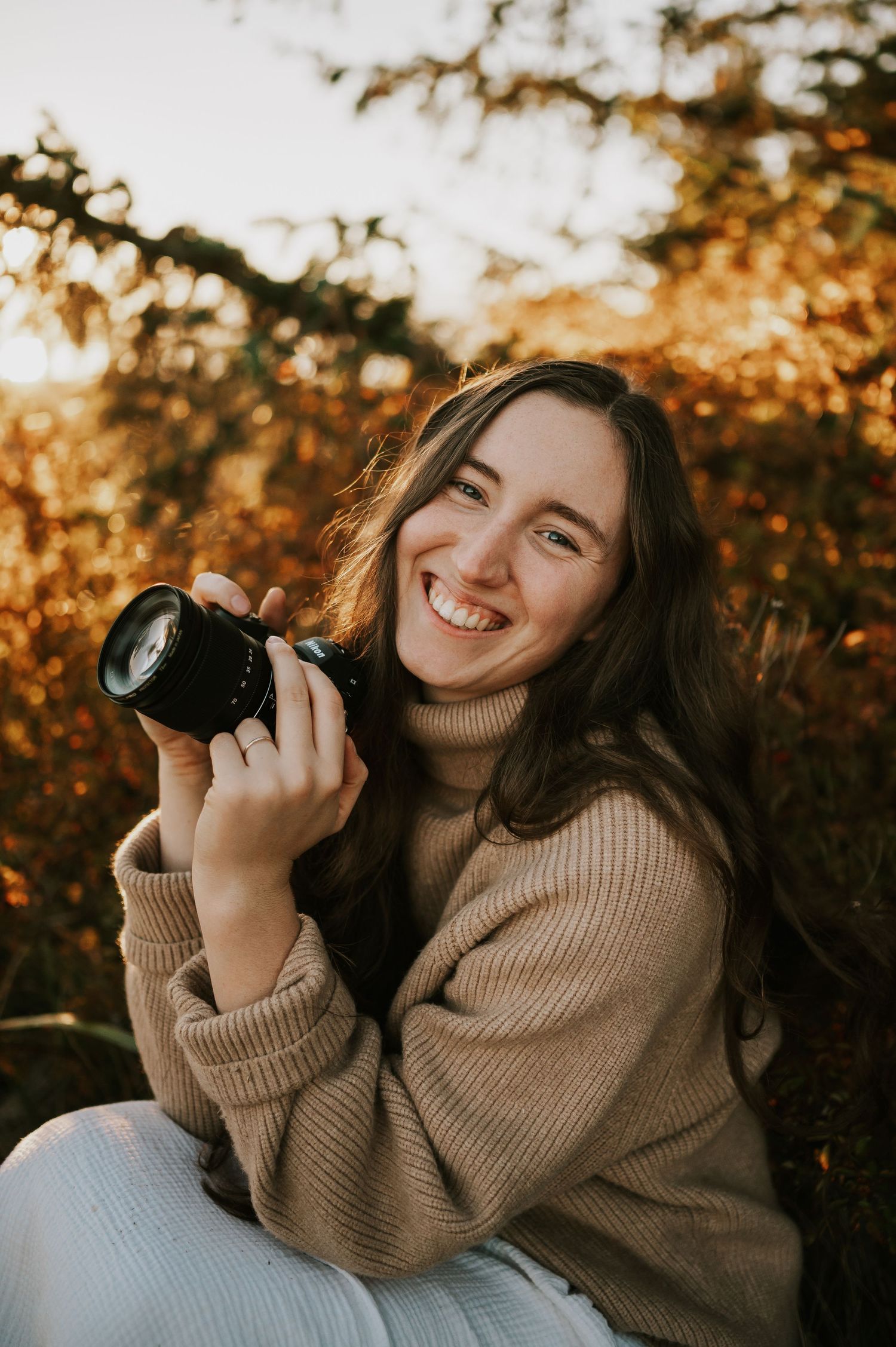 Photographer Katie Self portrait in fall coloured leaves Comox Valley on Vancouver Island. Photography by Photographer Soulfull Photographs