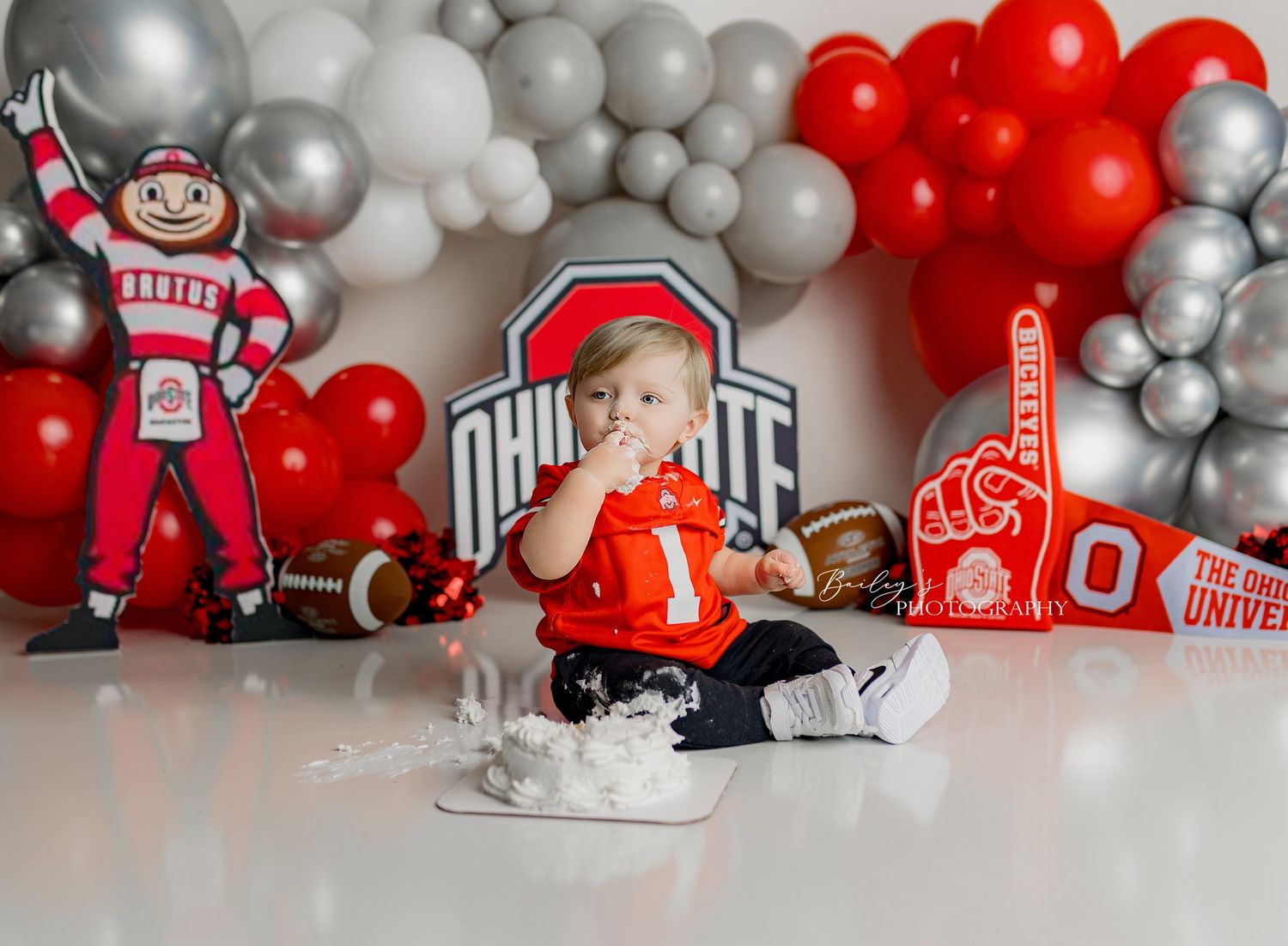 Colorful themed cake smash photos by Bailey’s Photography serving Portsmouth OH and surrounding Ohio and Kentucky areas