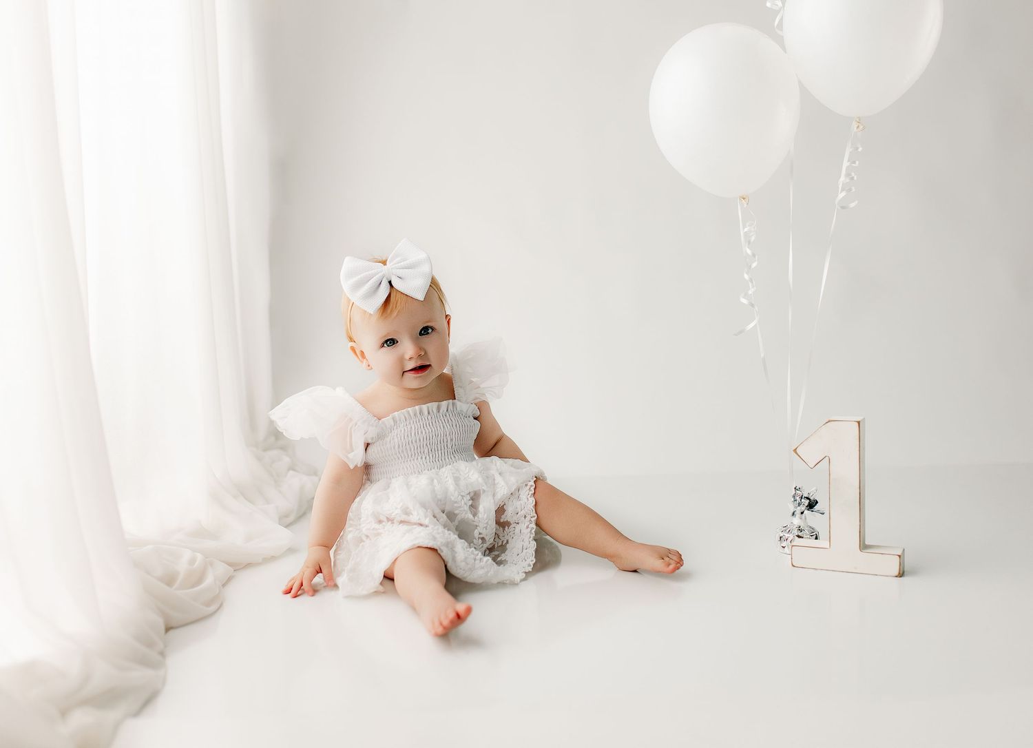 Best cake smash photographer near Chillicothe OH and Columbus OH creating custom milestone sessions for one year olds