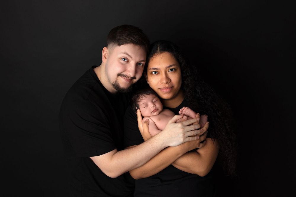 A romantic black and white photo series showing a couple embracing in six different intimate poses against a dark background.