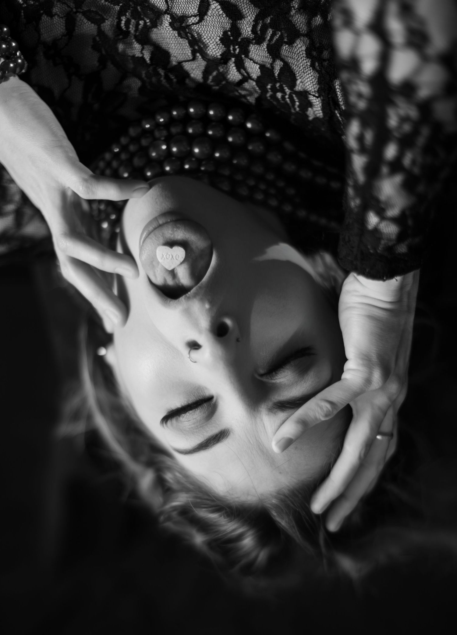 A dramatic black and white portrait sequence showing a figure turning and looking upward in five connected frames.